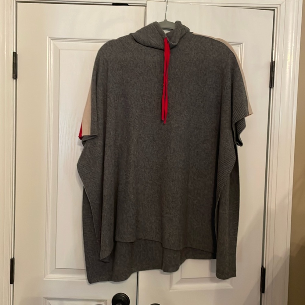 Tahari poncho in gray with tan and red details. 70% Merino wool/30% cashmere.